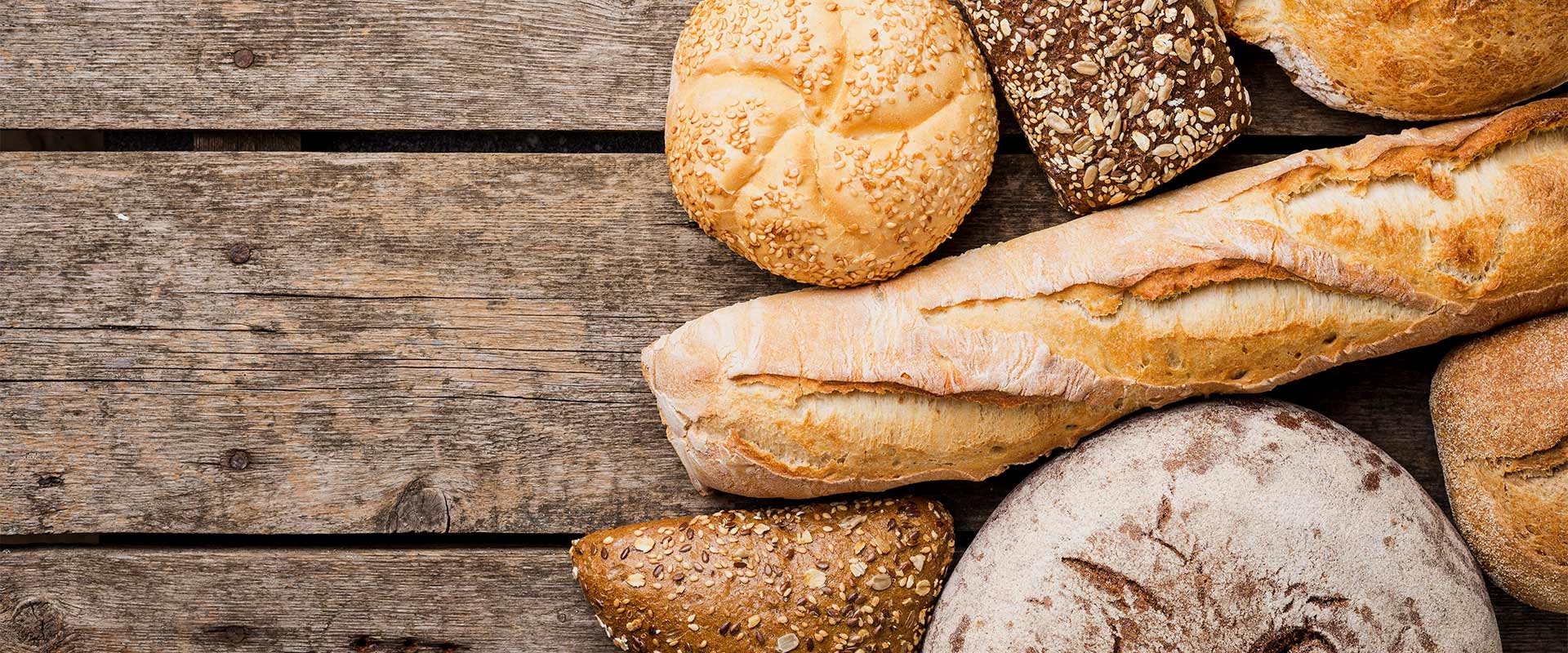 bread-buns-top-view-with-wooden-background