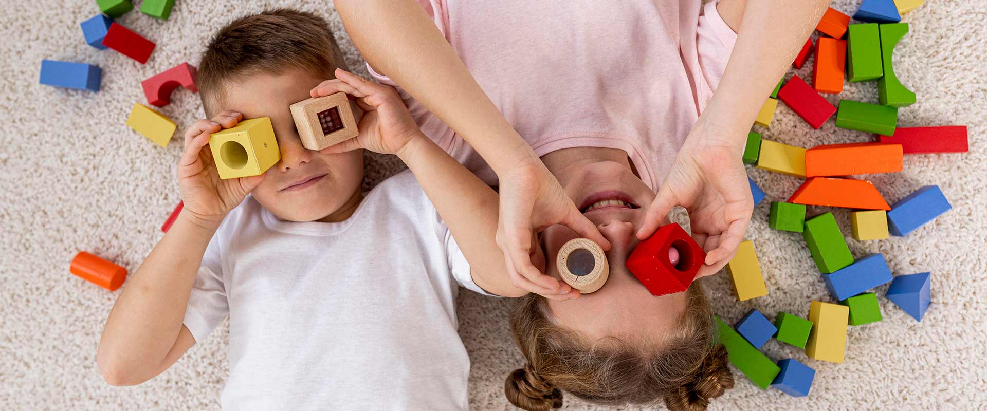 top-view-non-binary-kids-playing-with-colorful-game